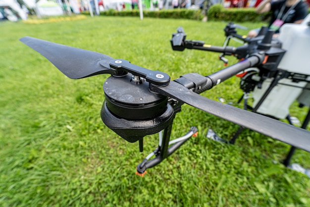 Professional agriculture drone on the green field