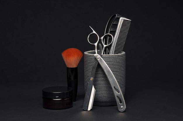 Professional barber tools displayed against a dark background