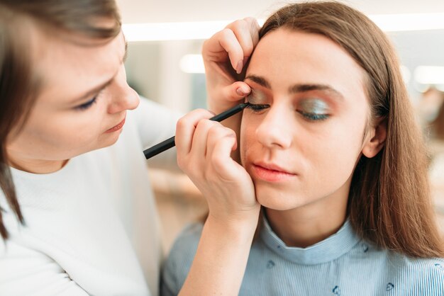 Professional beautician work with woman eyebrows