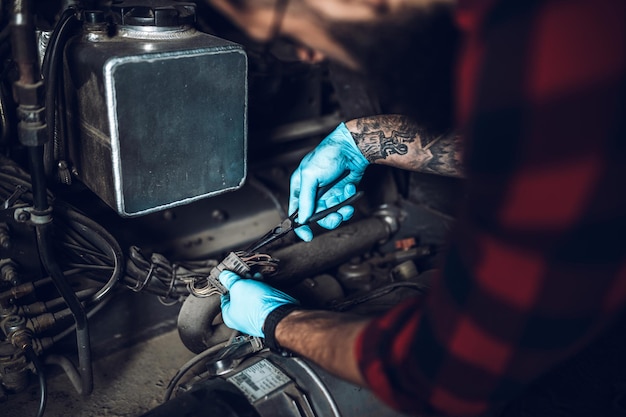 Professional bus mechanic working in vehicle repair service.