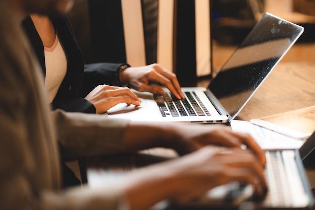 Professional business person typing on computer laptop desk at office using keyboard technology for working on online workplace communication job