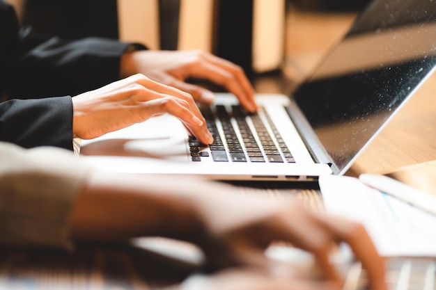 Professional business person typing on computer laptop desk at office using keyboard technology for working on online workplace communication job