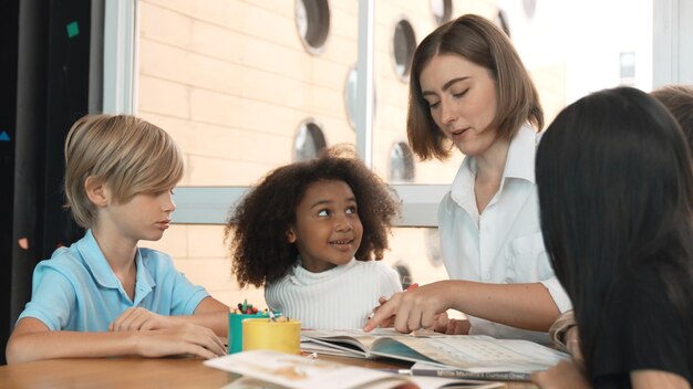 Professional caucasian teacher telling story to diverse student erudition