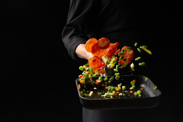 Professional chef cooks vegetables in a pan Asian cuisine Oriental background for the menu recipe book