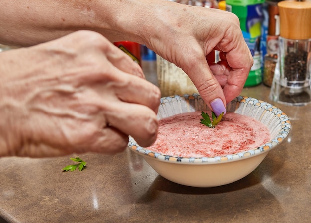 Photo professional chef prepares gazpacho in blender at home kitchen with expert hands