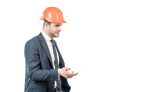 Professional civil engineer in hardhat and suit gesticulating isolated on white copy space engineering