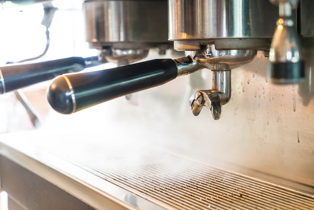 Professional coffee machine making espresso in a cafe