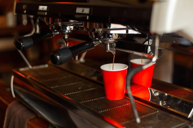 Professional coffee machine making espresso in a cafe