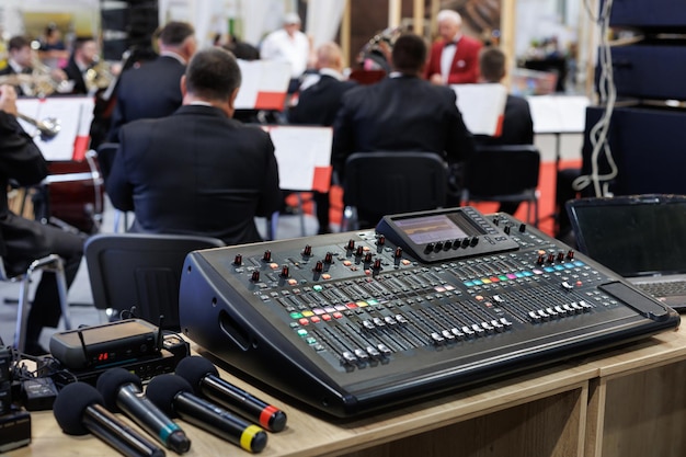 Professional concert mixing console and microphones at the conference