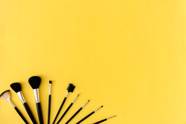 Professional cosmetics and makeup brushes. Beauty fashion mockup top view