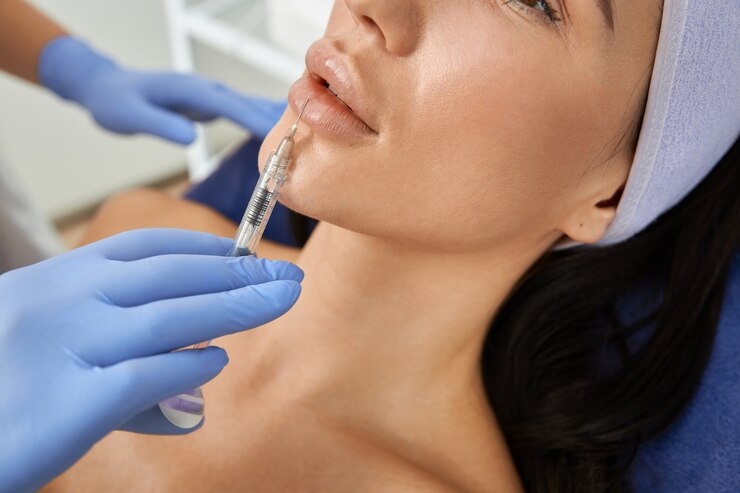 Professional cosmetologist is doing procedures for client in cabinet