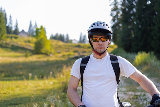 Professional cyclist riding bicycle on the mountain forest