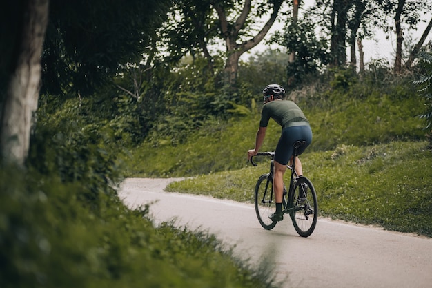 Professional cyclist training alone at green park