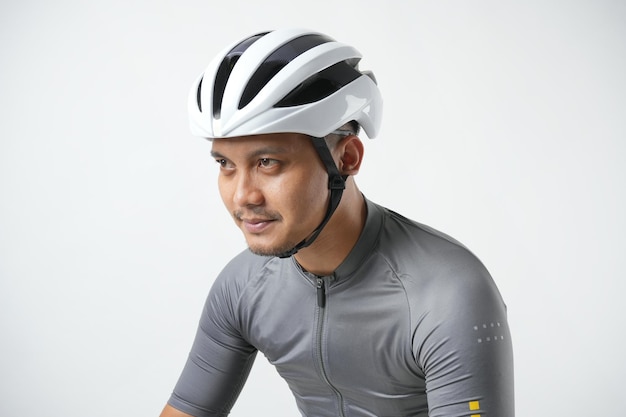 Professional cyclist wearing grey t-shirt and white bike helmet with sport and bikers concept