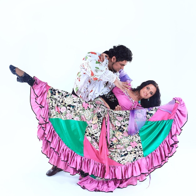 Professional dance couple in a Gypsy costume perform folk dance