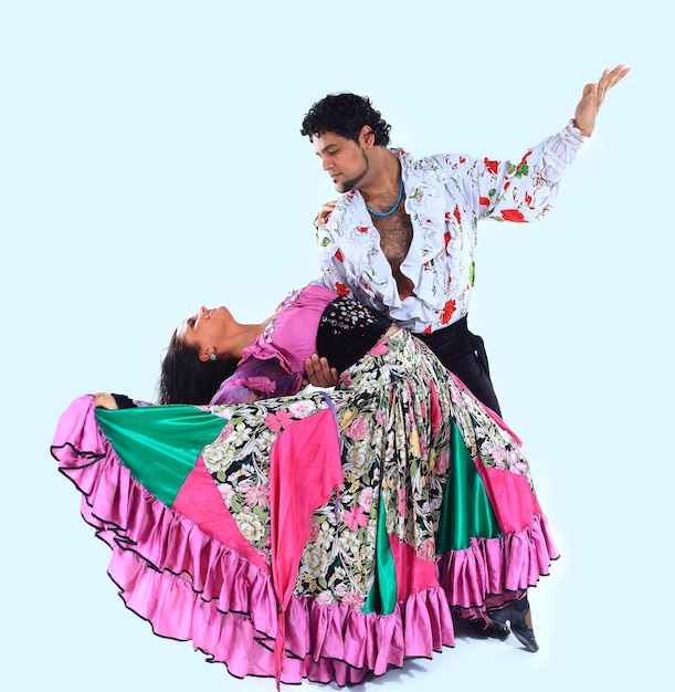 Professional dance couple in a gypsy costume perform folk dance