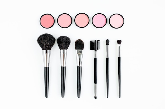 Professional decorative cosmetics makeup tools on white background flat composition beauty fashion f