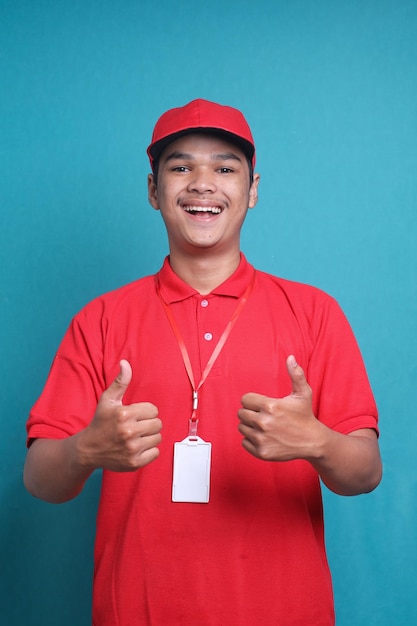 Professional delivery guy employee man in red cap T-shirt uniform workwear work as dealer courier sh