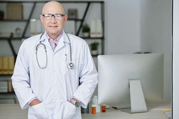 Professional doctor standing at office