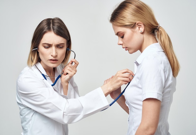 Professional doctor with stethoscope heartbeat patient health work