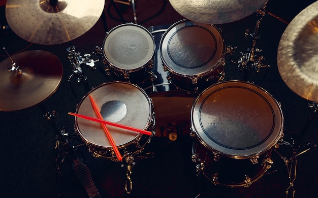 Professional drum kit and sticks closeup, nobody