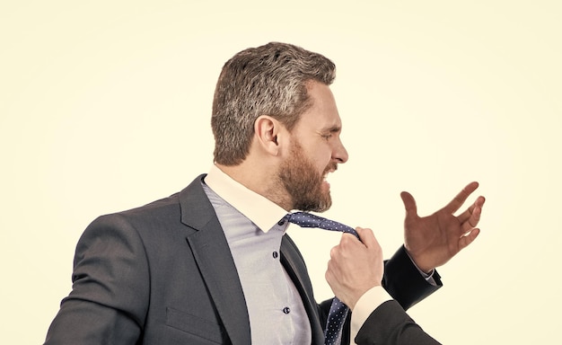Professional employee man filled with indignation being pulled by necktie conflict