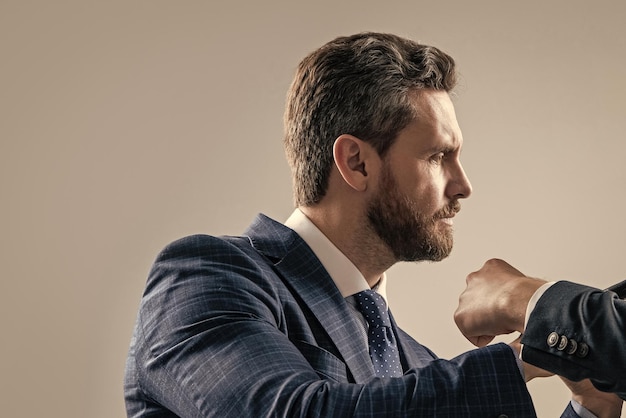 Professional employee man got in physical fight grey background fighting