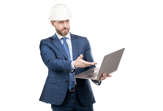 Professional engineer in hardhat point at laptop screen for engineering computer software