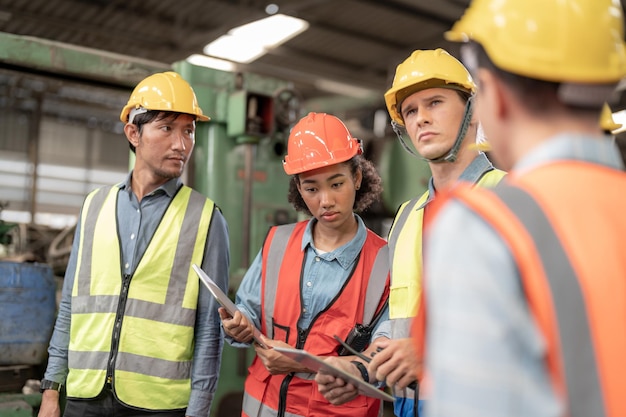 Professional engineering workers walk and check in warehouse factory Manager Engineer Operating