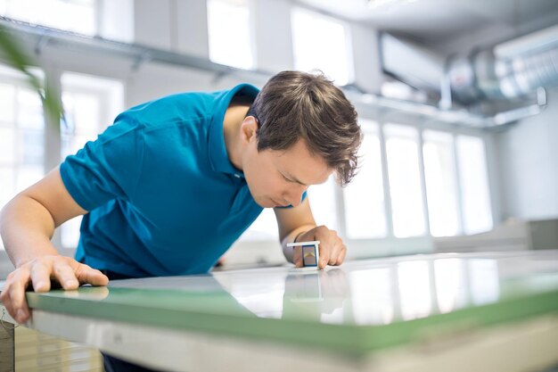 professional examining printed media with magnifying glass