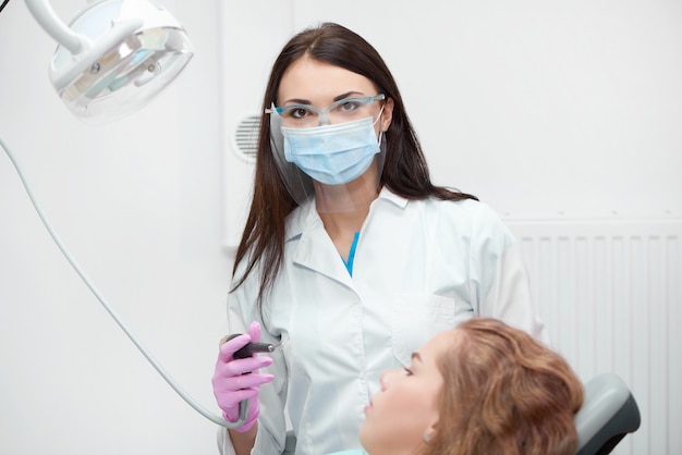 Professional female dentist at work