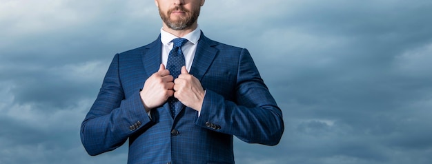 Professional guy crop view Unshaven guy in suit Guy sky background copy space