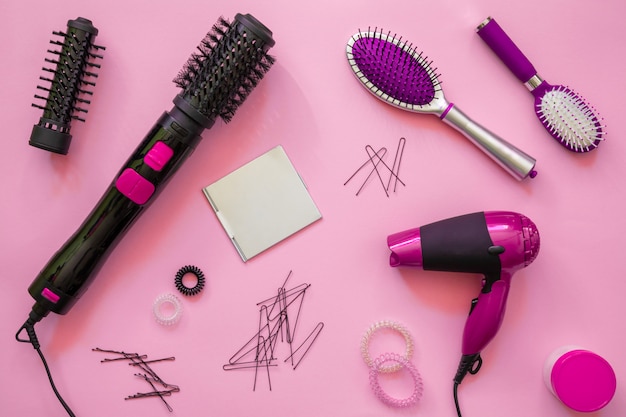 Professional hairdressing tools, pink background