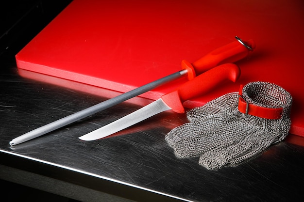 Professional kitchen. Knives, a board on the kitchen table