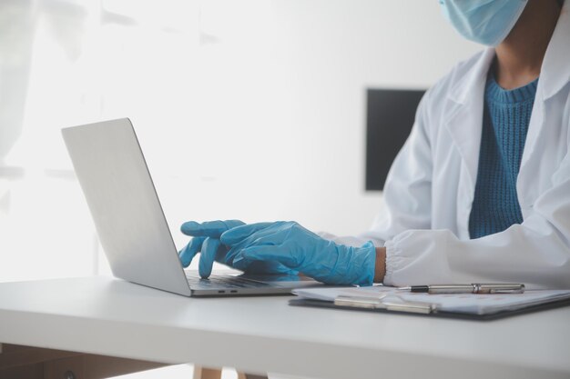 professional lab amazing longhaired medical worker wearing uniform while using microscope during research
