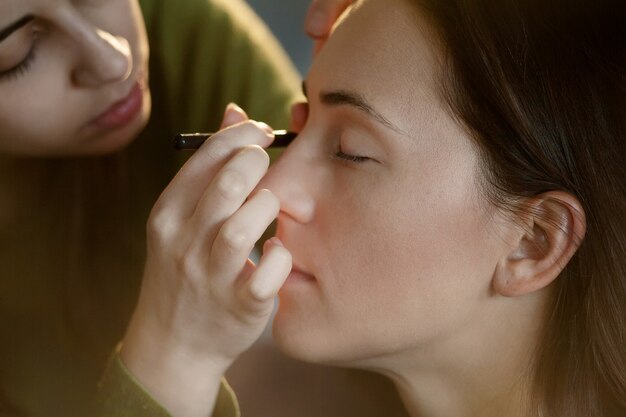 Professional Make-up artist doing glamour makeup at work