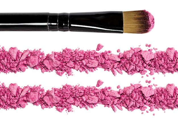 Photo professional make-up brush on red crushed eyeshadow