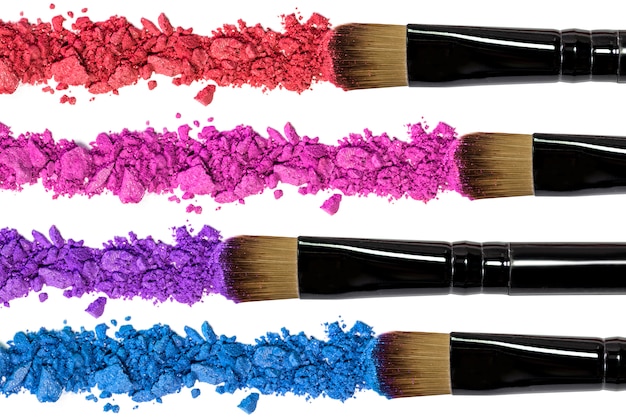 Professional make-up brush on red crushed eyeshadow