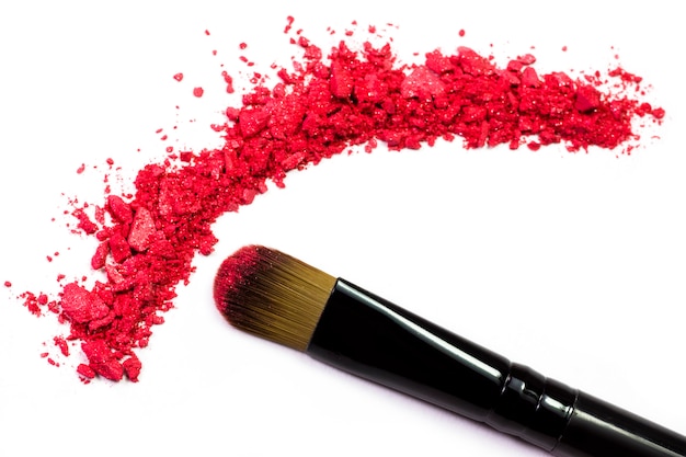 Photo professional make-up brush on red crushed eyeshadow