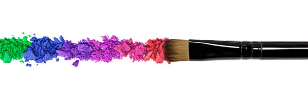 Professional make-up brush on red crushed eyeshadow