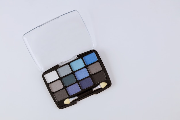 Professional makeup palette decorative cosmetics for eye makeup on a isolated white table