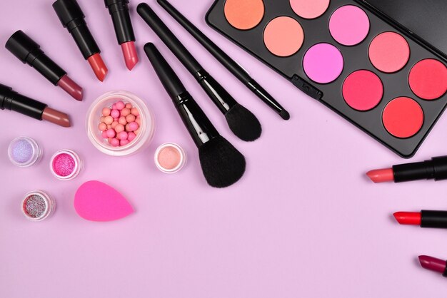 Professional makeup products with cosmetic beauty products, blushes, eye liner, eye lashes, brushes and tools.