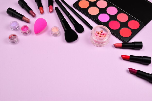 Professional makeup products with cosmetic beauty products blushes eye liner eye lashes brushes and tools