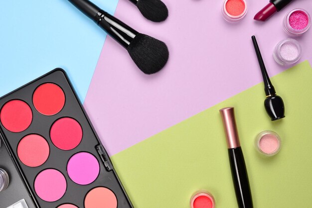 Professional makeup products with cosmetic beauty products blushes eye liner eye lashes brushes and tools