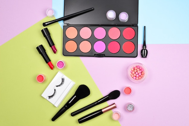 Professional makeup products with cosmetic beauty products, blushes, eye liner, eye lashes, brushes and tools.