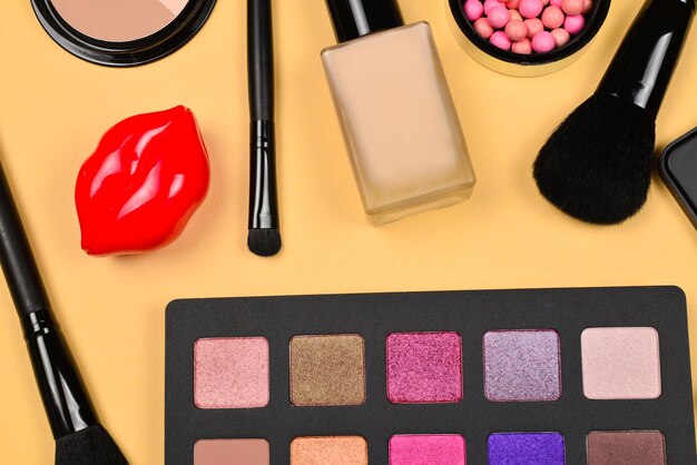 Professional makeup products with cosmetic beauty products foundation lipstick eye shadows eye lashes brushes and tools