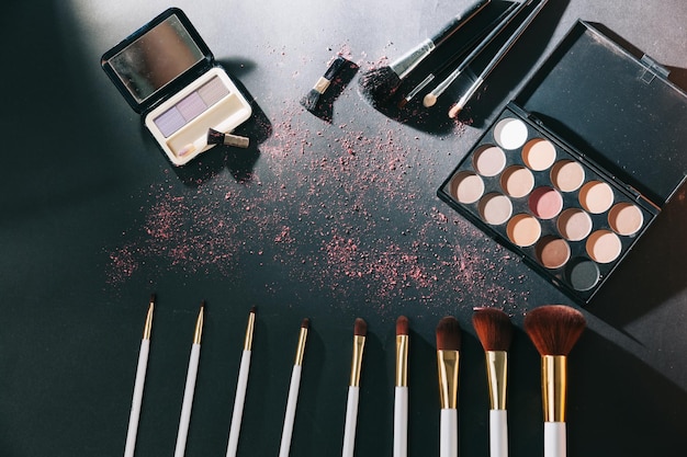 Professional makeup set isolated on black background