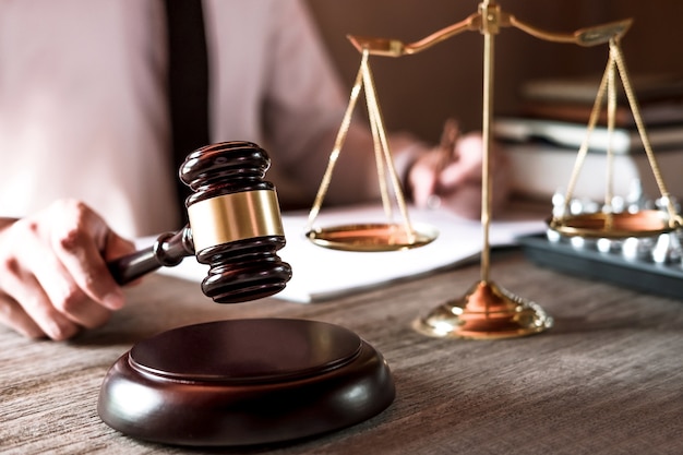 Professional male lawyers working on courtroom sitting at the table 