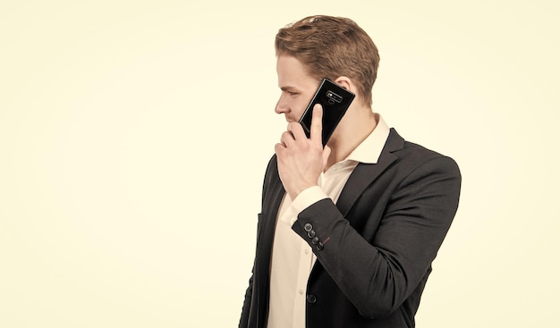 Photo professional man in business suit talk on mobile phone isolated on white copy space cellphone