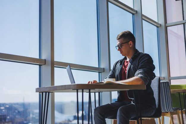 professional manager working with business information corporate money investment report writing notes while doing online research on laptop computers digital marketing